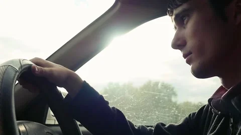 Man driving the car under sunset sky at outdoor in slowmotion. Summer time Stock Footage 61039031