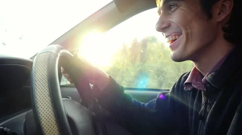 Man driving the car under sunset sky at outdoor in slowmotion. Summer time Stock Footage 61039915