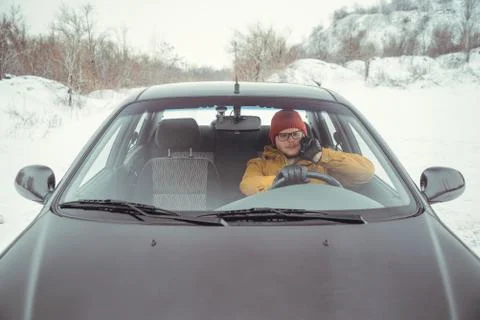Man driving car using smart phone in car Stock Photos