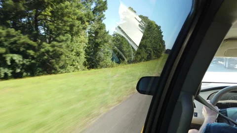 Man driving down highway view of steering wheel speeding down road in vehicle Stock Footage 214199753