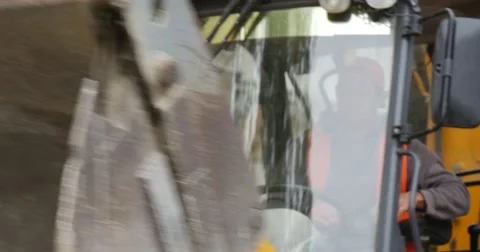 Man is Driving an Excavator Worker in Orange Workwear Stopped Have Got Out of Stock Footage 54328172