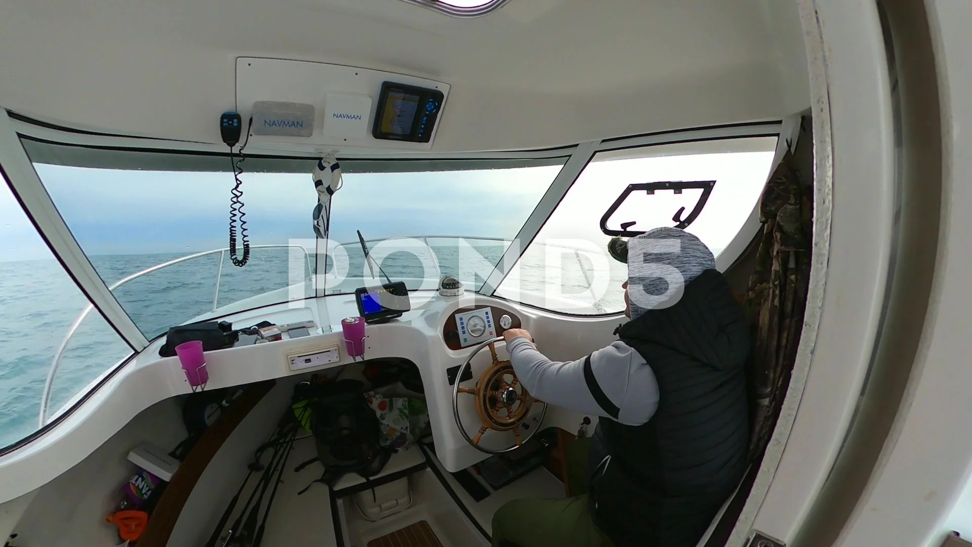 A man driving fishing boat in cabin on t, Stock Video