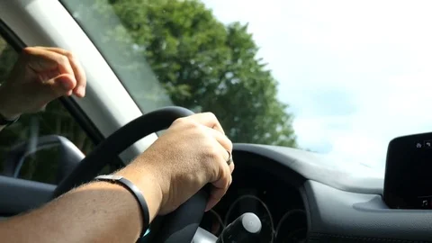 The man is driving Stock Footage 77570384