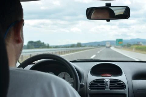 Man driving on a highway Stock Photos