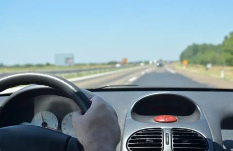 Man driving on a highway Stock Photos