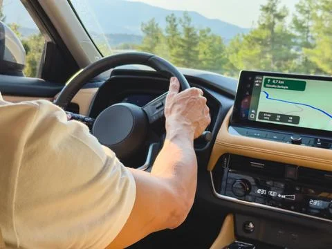 Man driving modern car using GPS navigation system Stock Photos