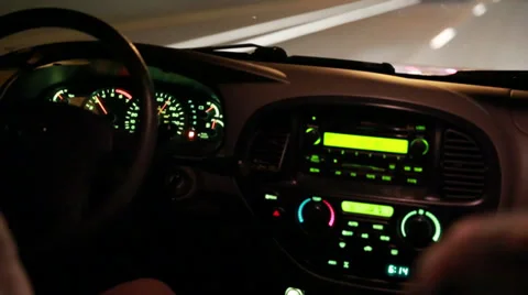 Man driving at night down a highway Stock Footage 32520518