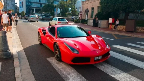 Man Driving A Red Ferrari 488 GTB In The Streets Of Monaco Stock Footage