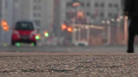 A man driving a red Smart car through a city Stock Footage