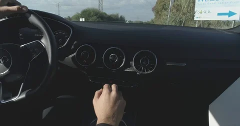 Man driving a sport car while shifting gears black dashboard Stock Footage 100048710