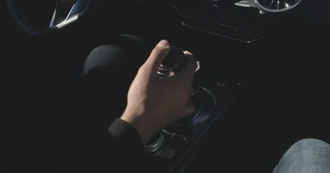Man driving a sport car while shifting gears black dashboard Stock Footage 100048802
