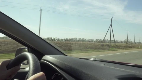 The man is driving at the wheel and pointing his finger forward Stock Footage 80530731