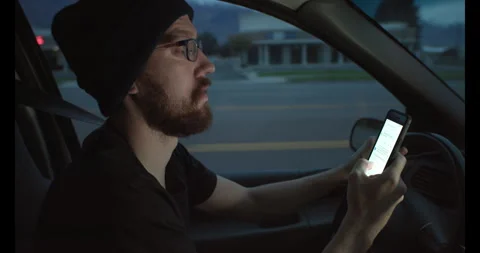 Man driving while texting dangerous Video stock 245400430