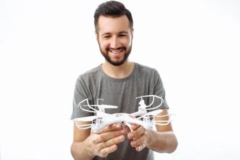 Man, drone in hand, on white background, isolated Stock Photos