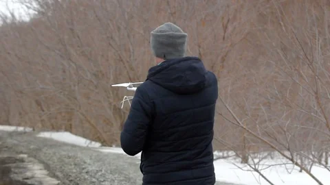 A man with a drone in hands preparing to flight. Stock Footage 69960542