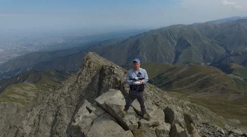 The man with the drone standing on a rock. Stock Footage 68453445