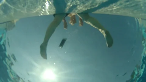 Man drop, dive and take out from pool bottom drown smartphone Video stock 82077371