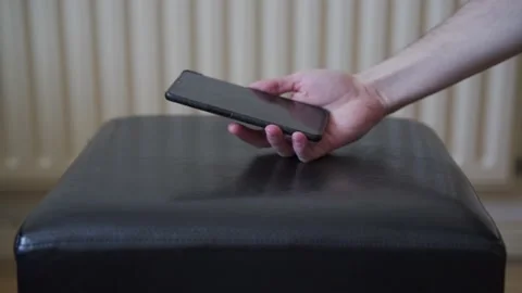 Man dropping a black phone 動画素材 132350740