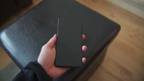 Man dropping a black phone 動画素材 132350742