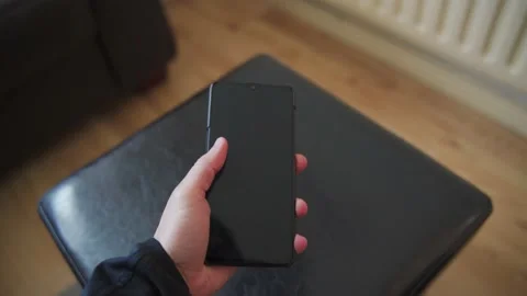 Man dropping a black phone 動画素材 132350799