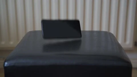 Man dropping a black phone Video stock 132350842