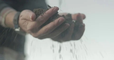 Man dropping dirt from hands Stock Footage 76405385
