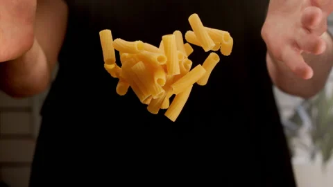 Man dropping pasta for cooking Stock Footage 156809241