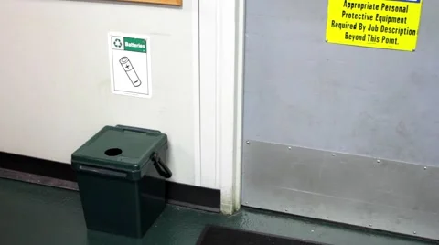 Man drops battery in recycling Stock Footage 66767019