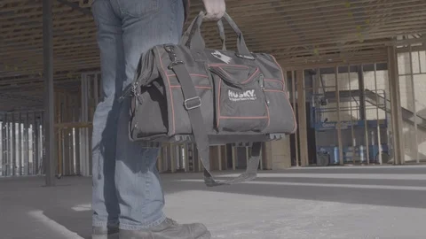 Man drops tool bag onto cement floor Stock Footage 102125083