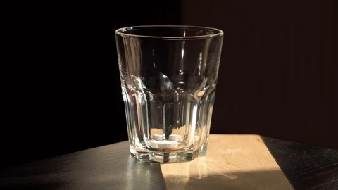 A man drops two tablets into a glass and fills them with water Stock Footage 119712519