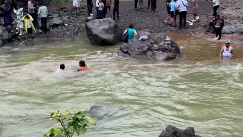 Man is drowning and being swept away by a river's current Stock Footage 340251807