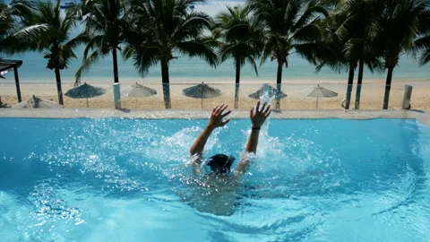 Man drowning in the pool try to survive by put hand up asking for help Stock Footage 134866656