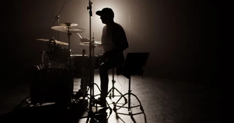 Man with drum and laptop playing music during sound check Stock Footage 249851634