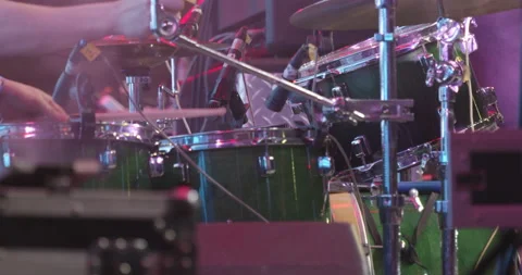 A man drummer playing drumset on a dark stage at nightclub Stock Footage 199908338