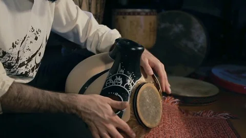 Man drumming out a beat on an arabic percussion drum named Frudu Video stock 74520501