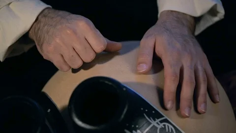 Man drumming out a beat on an arabic percussion drum named Frudu Video stock 74522509