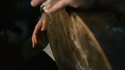 Man drumming out a beat on an arabic percussion drum named Bendir at home. Vidéo 74525423