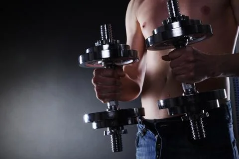 Man with dumbbells Stock Photos