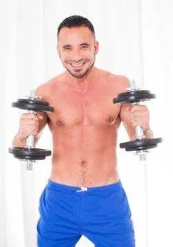Man with dumbell Stock Photos