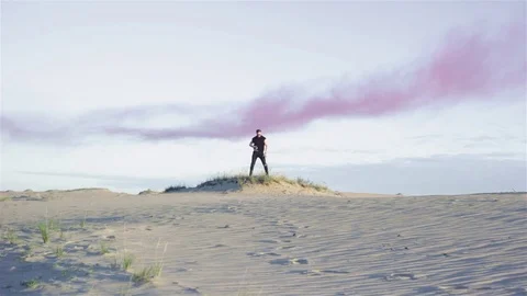 Man on dune in desert Stock Footage 77454933