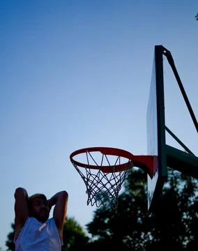 Man dunking in a basket Stock Photos