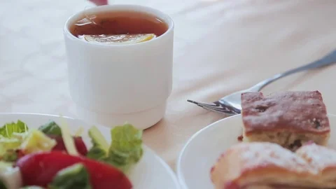 A man dunks a tea bag in the Cup Stock Footage 82107945