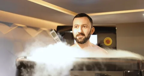 Man during cryotherapy in a special capsule Stock Footage 149410142