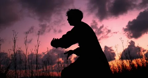 Man during a sunset practicing martial arts. Stock Footage 136026802