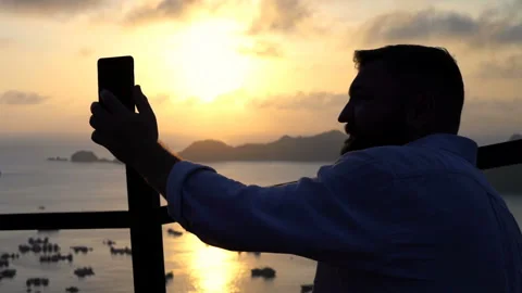 Man during video chat on smartphone at Ha Long Bay in Vietnam Stock Footage 163345927
