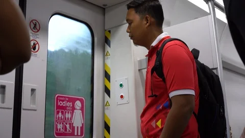 The man with earphone looking at the window in train Video stock 110922614