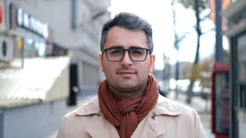 A man of Eastern appearance, a poet and artist with glasses looks at the camera Stock Footage 142166818