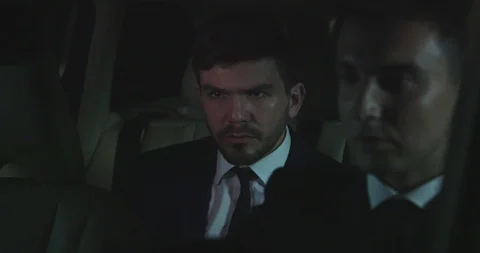 Man eat a burger in the back of a car. Stock Footage 116669584