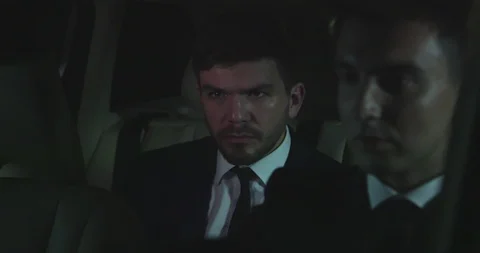 Man eat a burger in the back of a car. Stock Footage 119073639