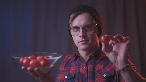 Man eat cherry tomato Stock Footage 118857761